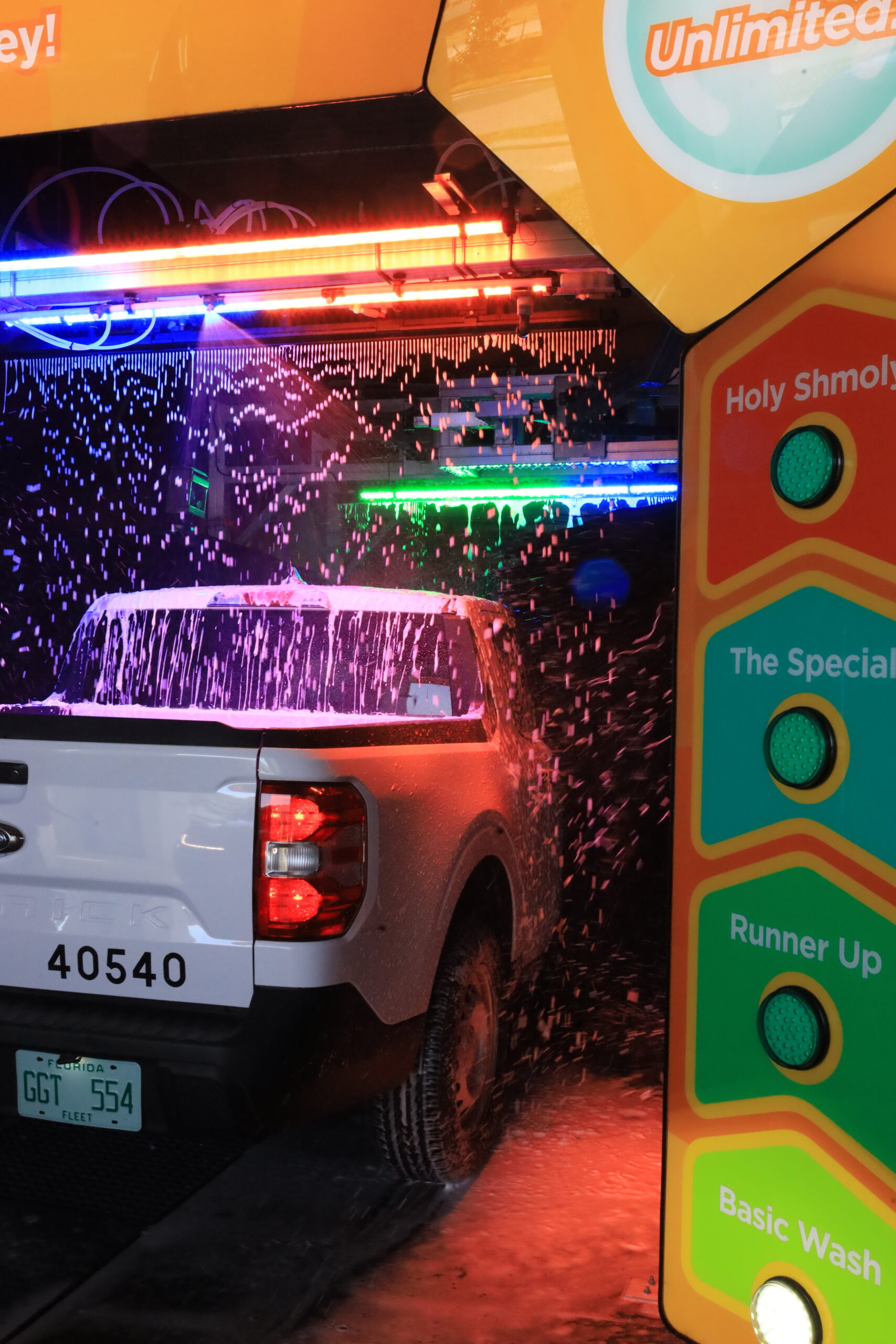 a car in an express car wash tunnel